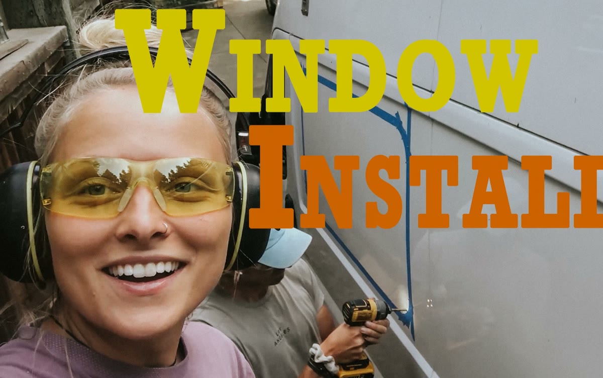 Emily and Nathaniel installing a van window